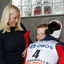 Skier Marit Bjørgen gives Prince Sverre Magnus a hug after her victory on the women's 30 kilometer cross country. Photo: Terje Bendiksby, NTB scanpix
